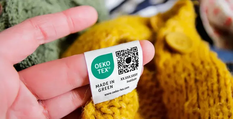 نمای نمادین از همکاری OEKO-TEX و سازمان ملل برای توسعه پایداری و شفافیت در صنعت مد و نساجی جهانی.