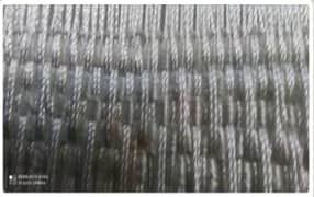 گیاه استبرق یا قلپلپ با برگ‌های پهن و میوه الیاف‌دار در خوزستان